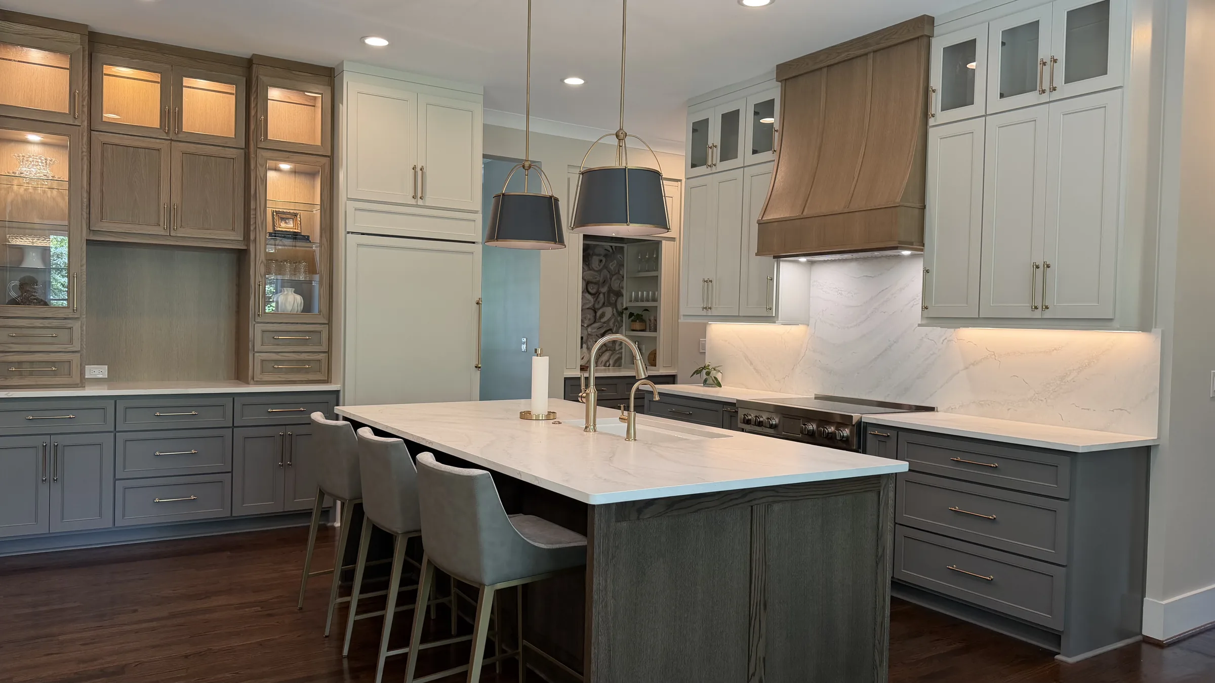 Custom two-tone kitchen cabinetry with wood hood by ERAZO HOME Atlanta GA